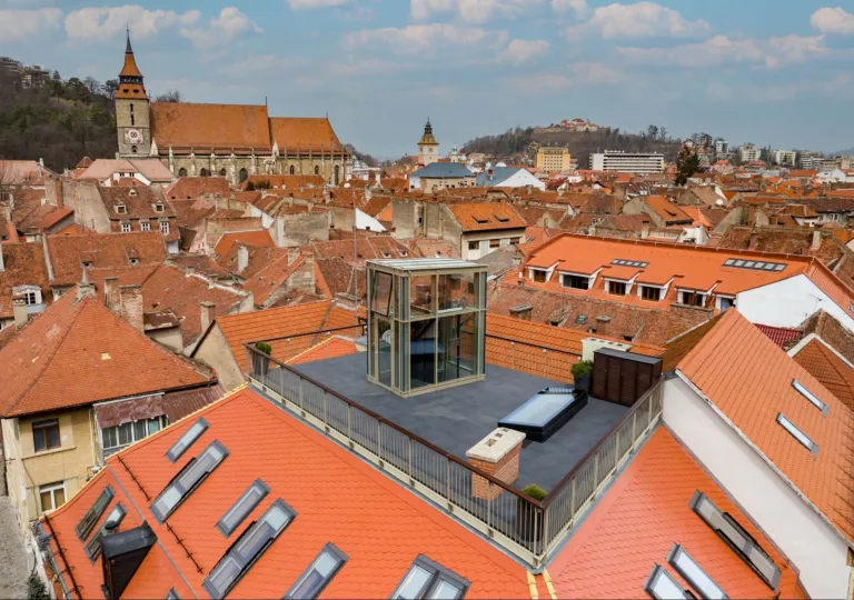 Rooftop view of orange buildings in a town center