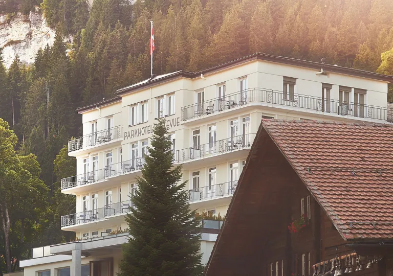 Exterior, vertical view of a white, multi-story hotel building