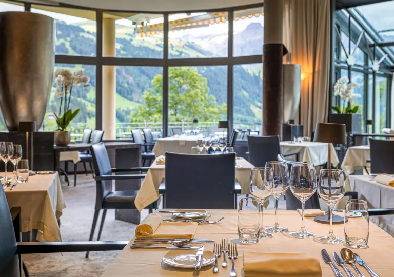 Restaurant with white tables and navy blue chairs