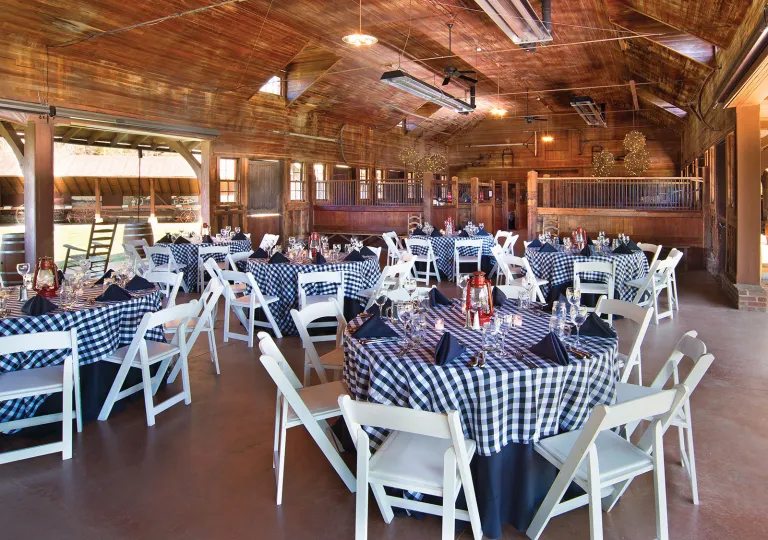 Restaurant dining hall with plaid-checkered tables and white chairs