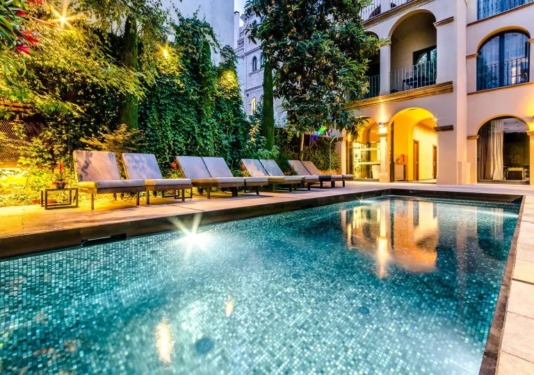 Outdoor pool illuminated in the evening