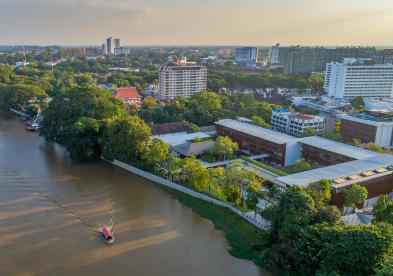 Sky view of city skyline, with a long river to the left
