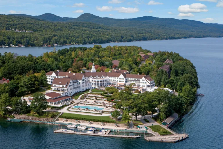 Sky view of a small peninsula with a large hotel complex by the shore
