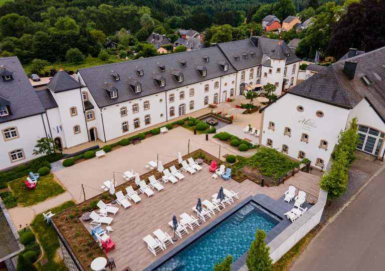 Sky view of a hotel complex and an outdoor pool