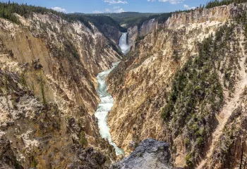 Active river cutting through two large mountains