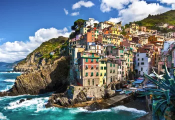 Cliffside by the ocean with buildings on top