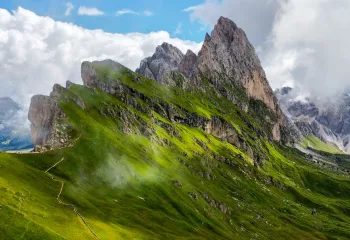 Steep mountain peaks covered in grass