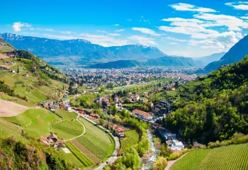 Sky view of valley with a small town in a grassy valley