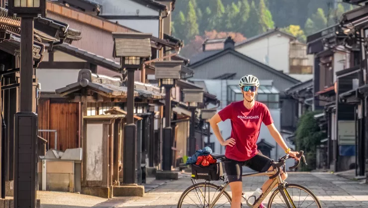 Cyclist posing in a suburban street