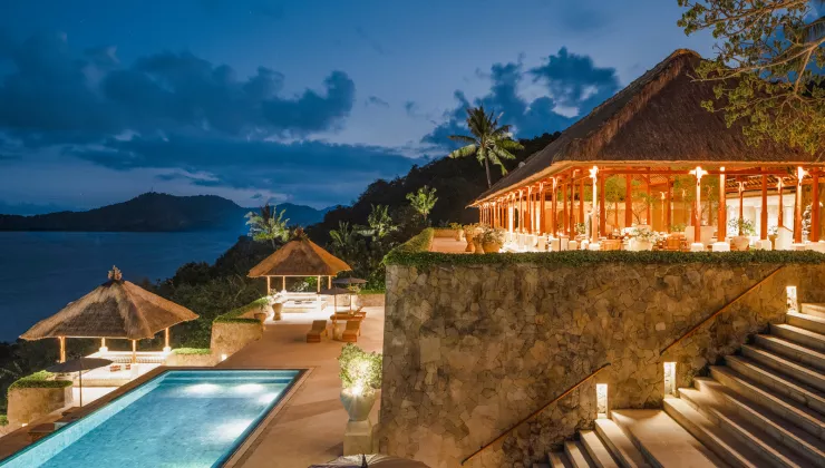 patio overlooking large pool during sunset