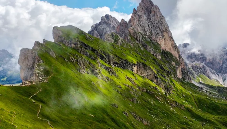 Steep mountain peaks covered in grass