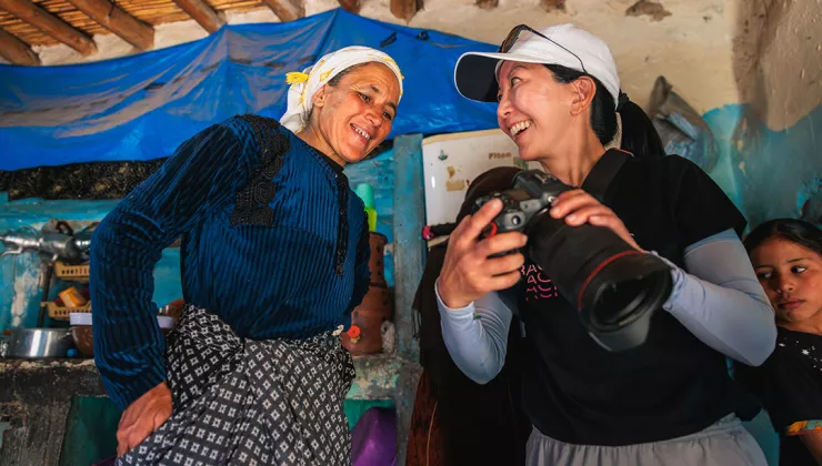 Woman showing another woman a photo on a camera