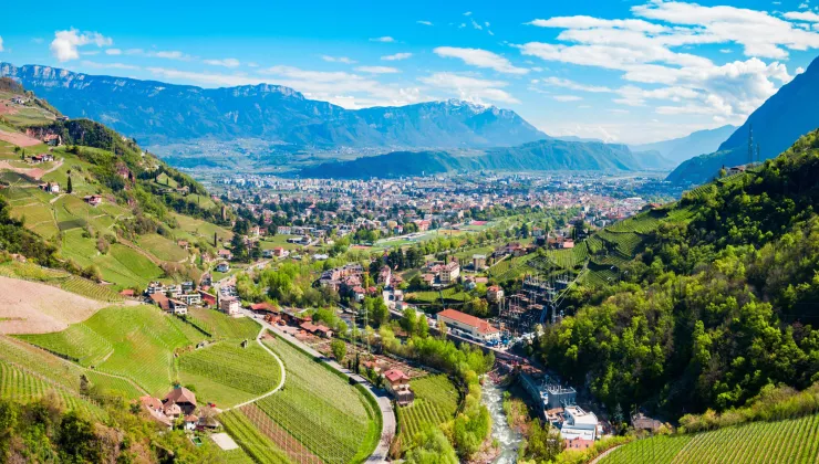 Sky view of valley with a small town in a grassy valley