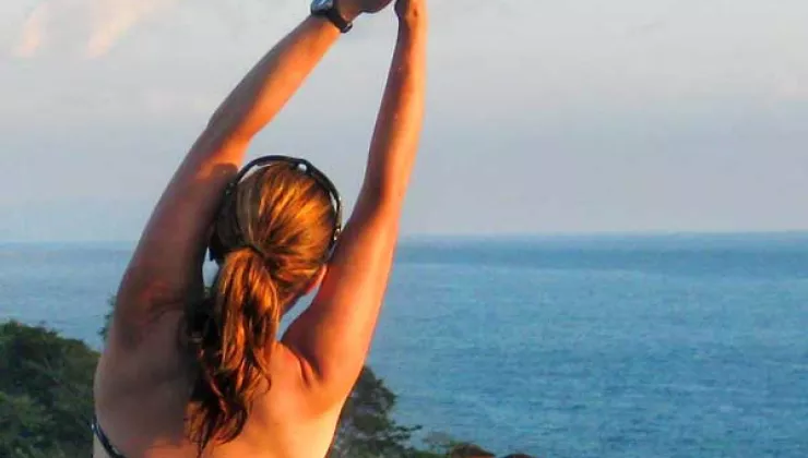 woman stretching yoga in Costa Rica, Hotel Punta Islita infinity pool