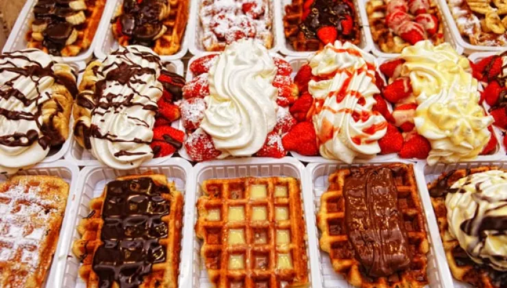 Variety of Belgian waffle desserts with toppings