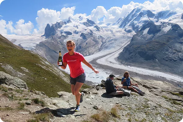 Backroads leader serving champagne in the Alps