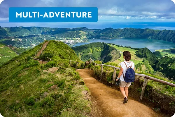 Woman walking along a hiking path in the Azores, Portugal