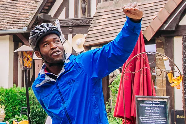 Backroads leader wearing a helmet, giving directions to a guest
