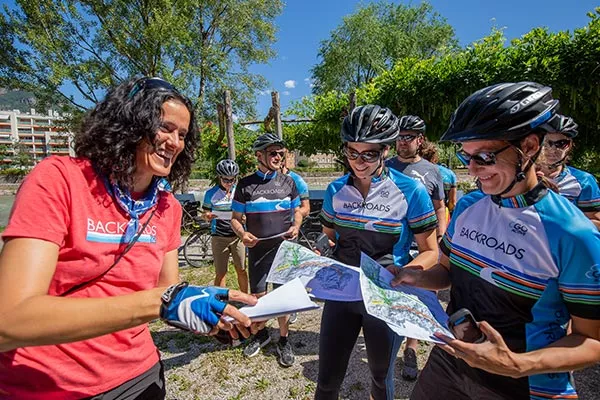 Backroads leader handing out maps