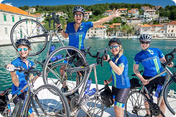 Group of four Backroads leaders with bikes