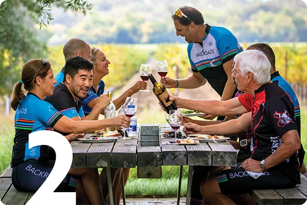 Group at picnic table in wine country 
