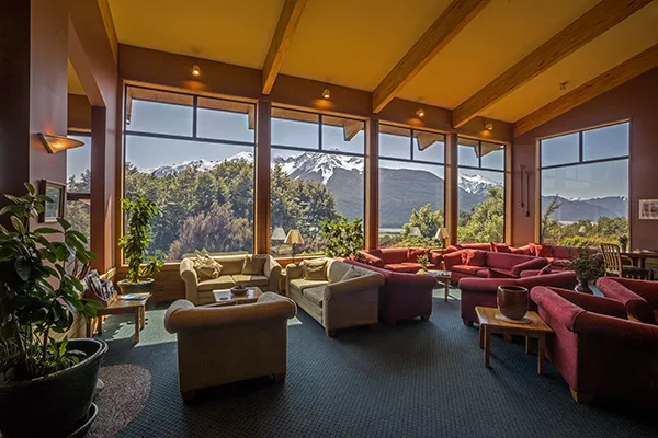 couches inside a room with large windows