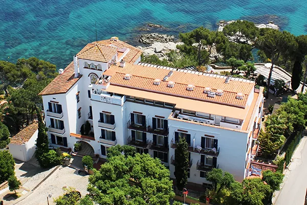 aerial view of hotel next to water