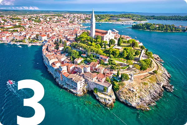 text:3; image: island of red roofed houses surrounded by blue water