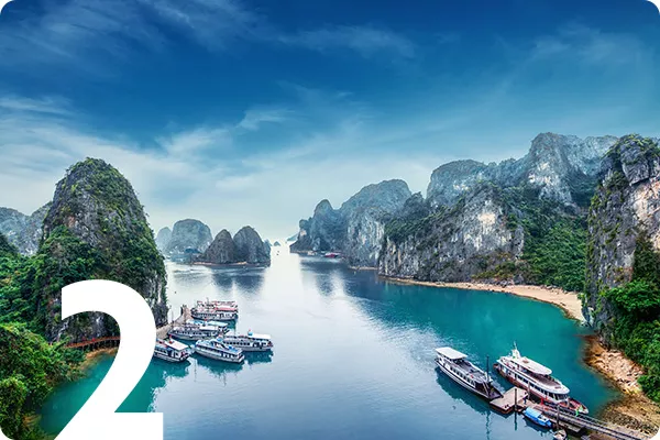 text:2; image: river with boats surrounded by large rocks