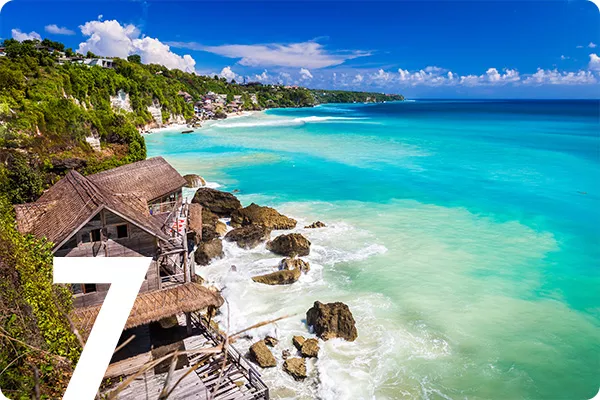 text:7; image: Beach house built into a cliff overlooking ocean waves