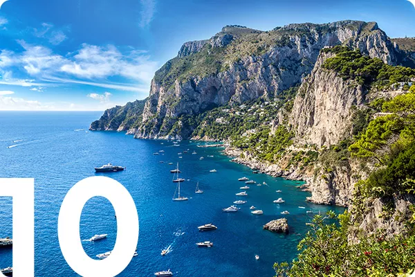 text:10; image: Mountainous coastline with clear blue water