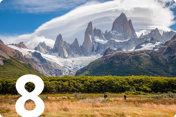 text:8; image: fields with mountain range in the background