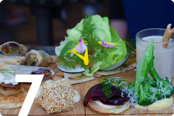 Number 7 overlayed over South African food close up 