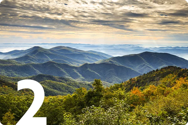 text:2; image: Mountains in Asheville with clouds