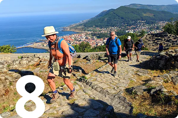 text:8; image: Hikers walking the Camino trail
