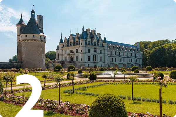 text:2; image: French Chateau surrounded by manicured gardens 