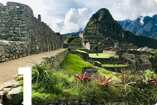 text: 1; image: Trail leading to large stone structures