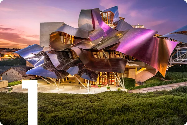 text:1; image: sculptural building with metal roof