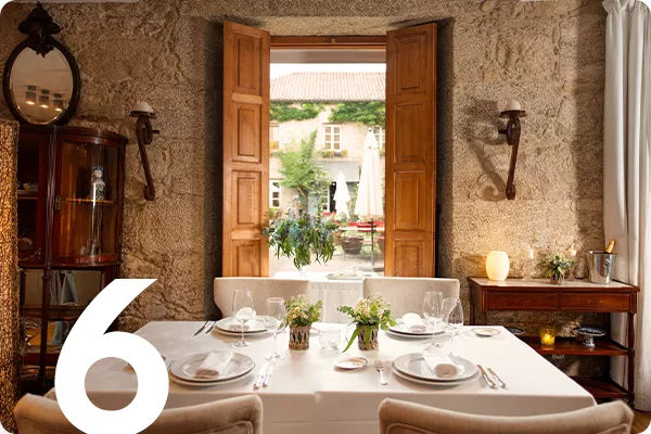 text:6; image: dining room with windows overlooking a courtyard