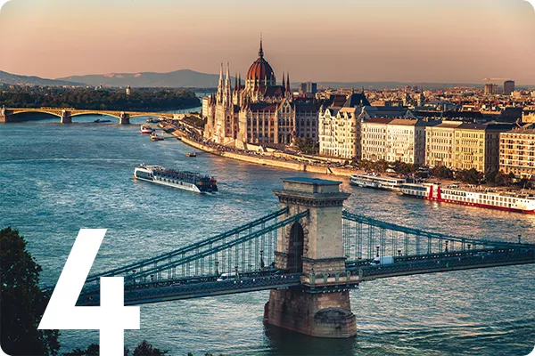 text:4; image: a river with several bridges running next to a city