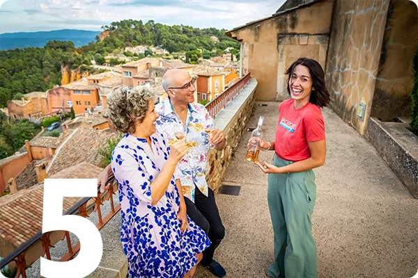 text:5; image: three people drinking wine on a terrace