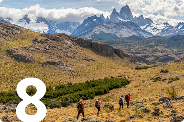 tetx:8; image: hikers walking across mountainous terrain