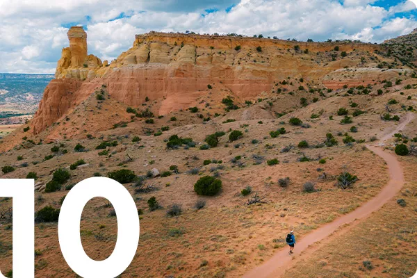 text:10; image: dry desert mountains with hiking path