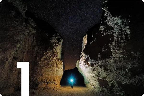 text:1; image: a flash of light between two rocks