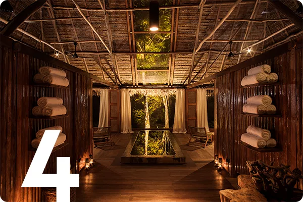 text:4; image: spa in a wood thatched house 