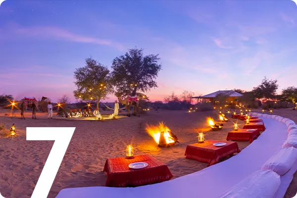 text:7; image: tables on a beach at sunset