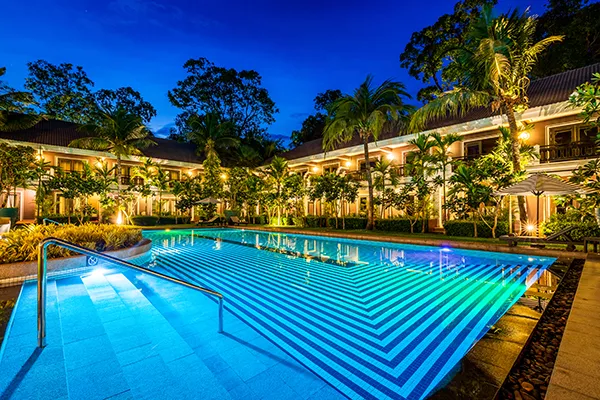swimming pool lit up at night