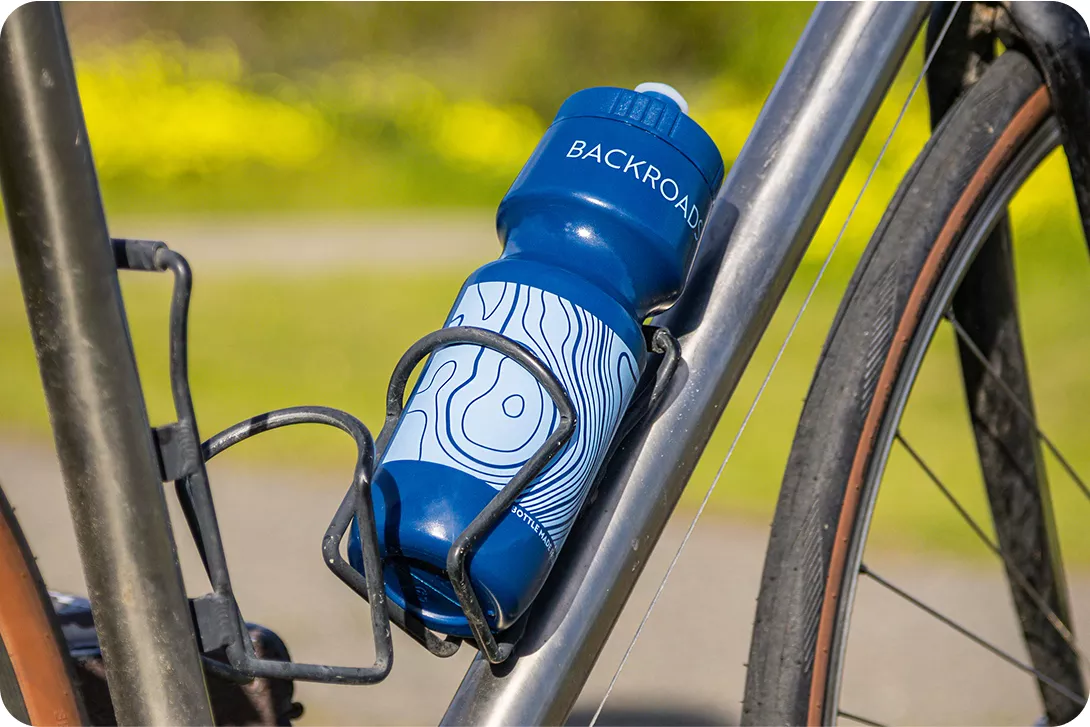 Blue water bottle with a branded Backroads logo