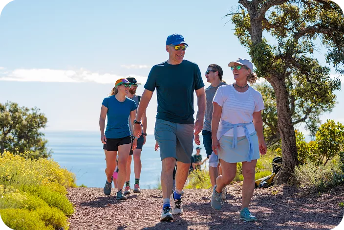 Group of people hiking on a dirt trail