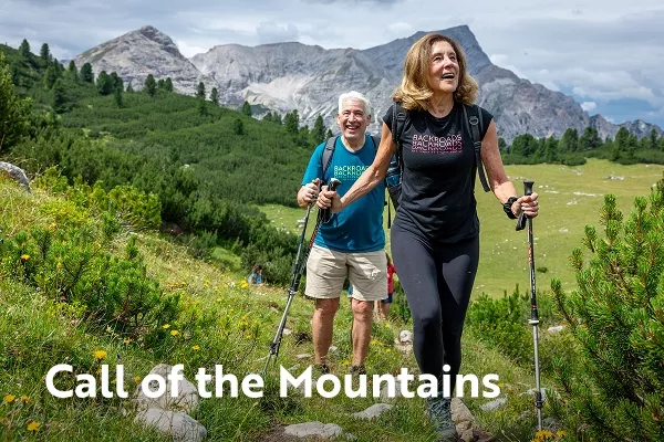 backroads travelers on a hike; text overlay: call of the mountains